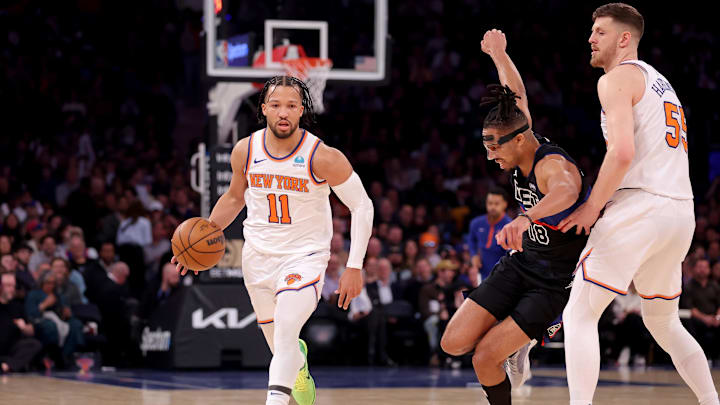 Mar 25, 2024; New York, New York, USA; New York Knicks center Isaiah Hartenstein (55) sets a pick against Detroit Pistons forward Tosan Evbuomwan (18) as Knicks guard Jalen Brunson (11) brings the ball up court during the first quarter at Madison Square Garden. Mandatory Credit: Brad Penner-Imagn Images