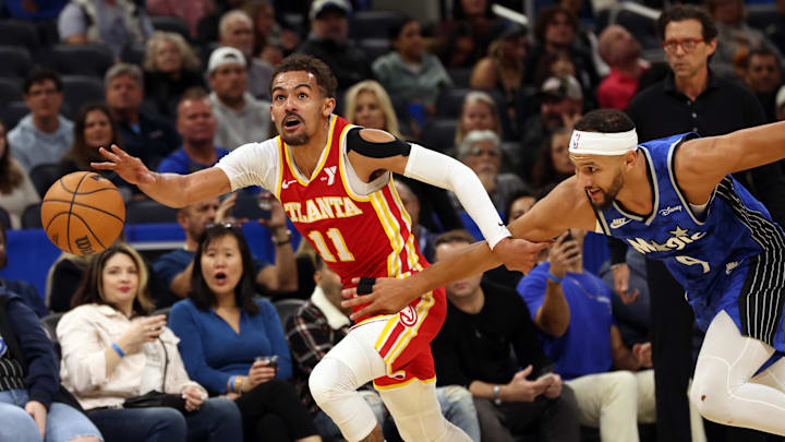 Jan 7, 2024; Orlando, Florida, USA; Atlanta Hawks guard Trae Young (11) drives to the basket as Orlando Magic guard Jalen Suggs (4) defends during the first quarter at Kia Center. Mandatory Credit: Kim Klement Neitzel-Imagn Images Jan 7, 2024; Orlando, Florida, USA; Atlanta Hawks guard Trae Young (11) drives to the basket as Orlando Magic guard Jalen Suggs (4) defends during the first quarter at Kia Center. Mandatory Credit: Kim Klement Neitzel-Imagn Images