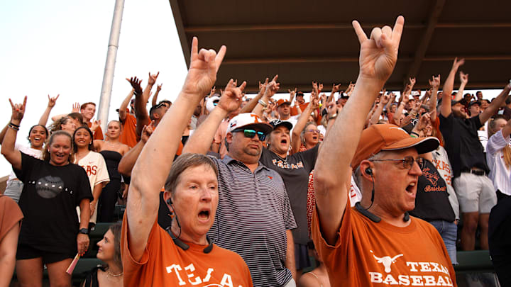 Fans welcome the Texas Longhorns to the field at the start of the second round in the NCAA baseball College Station Regional against the Texas A&M Aggies