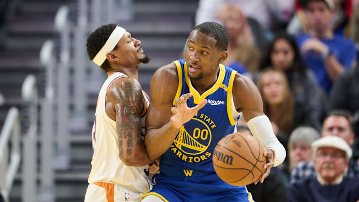 Dec 28, 2024; San Francisco, California, USA; Phoenix Suns guard Bradley Beal (3) defends against Golden State Warriors forward Jonathan Kuminga (00) during the third quarter at Chase Center. Mandatory Credit: Robert Edwards-Imagn Images