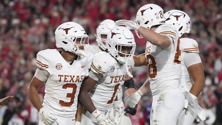 Texas Longhorns wide receiver Ryan Wingo (1) celebrates scoring a touchdown with teammates in the second half against the Georgia Bulldogs at Sanford Stadium.