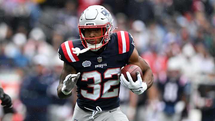 Sep 7, 2025; Foxborough, Massachusetts, USA; New England Patriots running back TreVeyon Henderson (32) rushes the ball against the Las Vegas Raiders in the first half at Gillette Stadium. Mandatory Credit: Brian Fluharty-Imagn Images