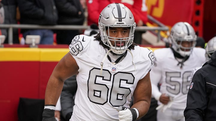Dec 25, 2023; Kansas City, Missouri, USA; Las Vegas Raiders guard Dylan Parham (66) runs onto the field against the Kansas City Chiefs prior to a game at GEHA Field at Arrowhead Stadium. Mandatory Credit: Denny Medley-Imagn Images