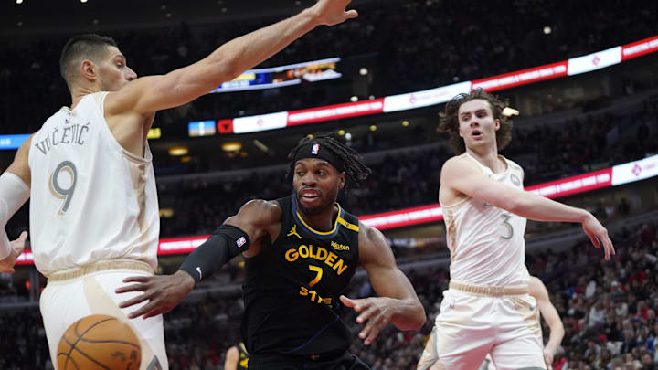 Feb 8, 2025; Chicago, Illinois, USA; Chicago Bulls center Nikola Vucevic (9) and guard Josh Giddey (3) defend Golden State Warriors guard Buddy Hield (7) during the first half at United Center. Mandatory Credit: David Banks-Imagn Images