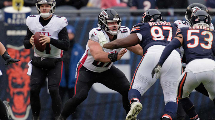 Falcons center Drew Dalman tries to handle Bears defensive tackle Andrew Billings on the pass rush.