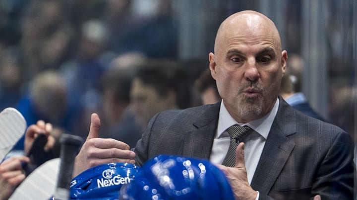 Nov 19, 2024; Vancouver, British Columbia, CAN; Vancouver Canucks head coach Rick Tocchet on the bench against the New York Rangers during the third period at Rogers Arena. Mandatory Credit: Bob Frid-Imagn Images