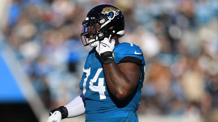 Jacksonville Jaguars offensive tackle Cam Robinson (74) walks off the field after being ejected for fighting with Carolina Panthers defensive tackle Derrick Brown (95), not shown, during the fourth quarter of a regular season NFL football matchup Sunday, Dec. 31, 2023 at EverBank Stadium in Jacksonville, Fla. The Jacksonville Jaguars blanked the Carolina Panthers 26-0. [Corey Perrine/Florida Times-Union]