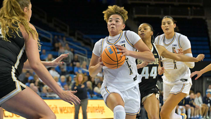 Jan 21, 2026; Los Angeles, California, USA;  Purdue Boilermakers forward Avery Gordon (55) defends UCLA Bruins guard Kiki Rice (1) as she drives past Purdue Boilermakers guard Tara Daye (44) in the first half at Pauley Pavilion presented by Wescom Financial. Mandatory Credit: Jayne Kamin-Oncea-Imagn Images