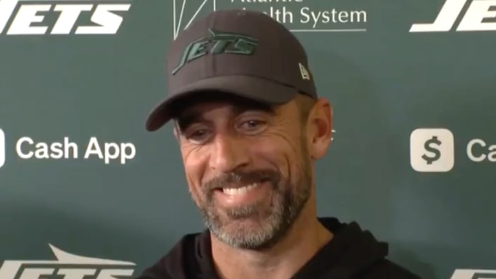 New York Jets quarterback Aaron Rodgers laughs while speaking to reporters from the Atlantic Health Training Center on Wednesday, November 13, 2024. 