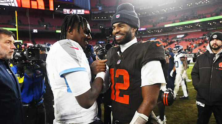Dec 7, 2025; Cleveland, Ohio, USA; Cleveland Browns quarterback Shedeur Sanders (12) shakes hands with Tennessee Titans quarterback Cam Ward (1) after the game at Huntington Bank Field. Mandatory Credit: Ken Blaze-Imagn Images