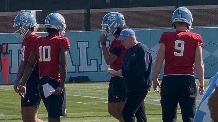 Bobby Petrino, center, is in his first season as the offensive coordinator for UNC football entering the Tar Heels' second year under head coach Bill Belichick.