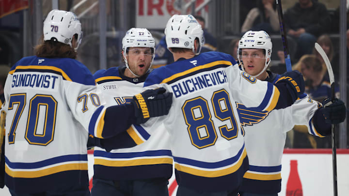Mar 13, 2025; Pittsburgh, Pennsylvania, USA;  St. Louis Blues center Oskar Sundqvist (70) and defenseman Cam Fowler (17) and left wing Pavel Buchnevich (89) celebrate with center Zack Bolduc (right) after Bolduc scored a gaol against the Pittsburgh Penguins during the second period at PPG Paints Arena. Mandatory Credit: Charles LeClaire-Imagn Images