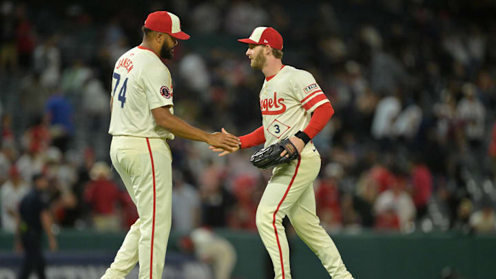 Sep 24, 2025; Anaheim, California, USA;  Los Angeles Angels left fielder Taylor Ward (3) congratulates relief pitcher Kenley Jansen (74) after his 28th save of the season in the ninth inning against the Kansas City Royals at Angel Stadium. Mandatory Credit: Jayne Kamin-Oncea-Imagn Images