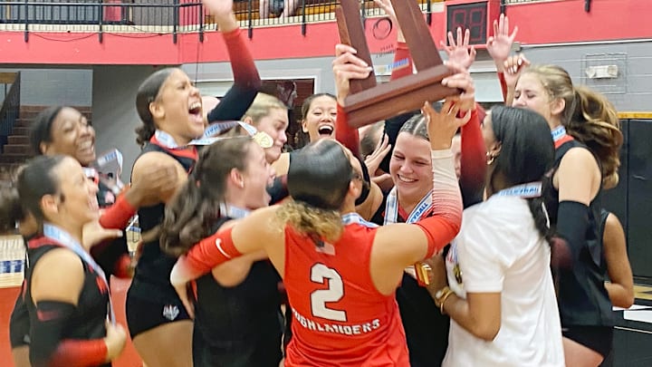 Lake Highland Prep players celebrate after winning the Class 3A girls volleyball state championship against Ocala Trinity Catholic on Wednesday at Polk State College in Winter Haven.