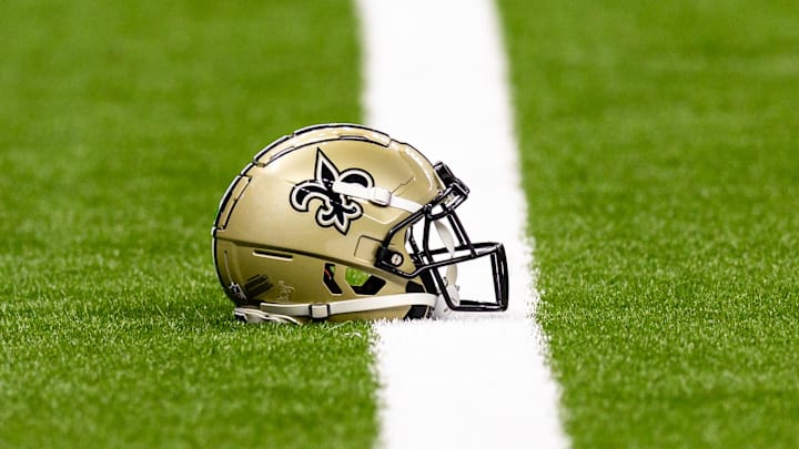 Aug 25, 2024; New Orleans, Louisiana, USA; New Orleans Saints helmet on the turf during warmups before the game against the Tennessee Titans at Caesars Superdome. Mandatory Credit: Stephen Lew-Imagn Images Aug 25, 2024; New Orleans, Louisiana, USA; New Orleans Saints helmet on the turf during warmups before the game against the Tennessee Titans at Caesars Superdome. Mandatory Credit: Stephen Lew-Imagn Images