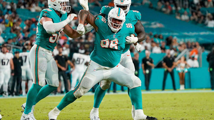 Miami Dolphins defensive tackle Brandon Pili (96) celebrates a tackle for loss during the fourth quarter of a preseason game at Hard Rock Stadium on Friday, August 11, 2023, in Miami Gardens, FL.