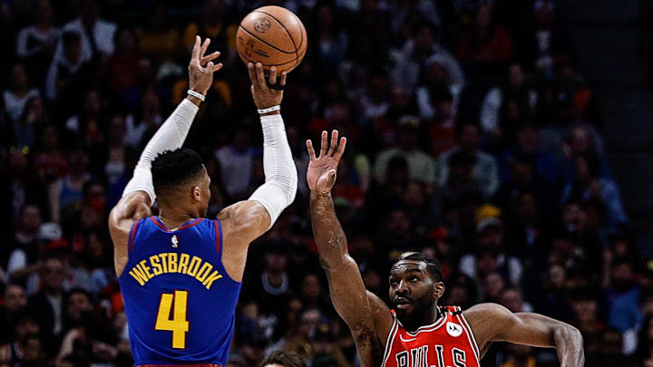 Mar 24, 2025; Denver, Colorado, USA; Denver Nuggets guard Russell Westbrook (4) attempts a shot under pressure from Chicago Bulls forward Patrick Williams (44) as forward Zach Collins (12) defends in the first quarter at Ball Arena. Mandatory Credit: Isaiah J. Downing-Imagn Images Mar 24, 2025; Denver, Colorado, USA; Denver Nuggets guard Russell Westbrook (4) attempts a shot under pressure from Chicago Bulls forward Patrick Williams (44) as forward Zach Collins (12) defends in the first quarter at Ball Arena. Mandatory Credit: Isaiah J. Downing-Imagn Images