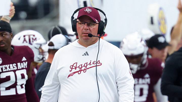 Texas A&M Aggies head coach Mike Elko during the first half against the Arkansas Razorbacks at AT&T Stadium. Texas A&M Aggies head coach Mike Elko during the first half against the Arkansas Razorbacks at AT&T Stadium.