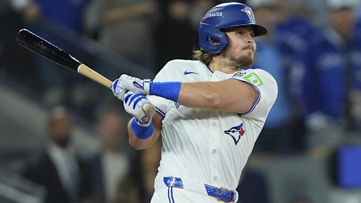 Nov 1, 2025; Toronto, Ontario, CAN; Toronto Blue Jays third baseman Addison Barger (47) hits a single against the Los Angeles Dodgers in the second inning during game seven of the 2025 MLB World Series at Rogers Centre. 