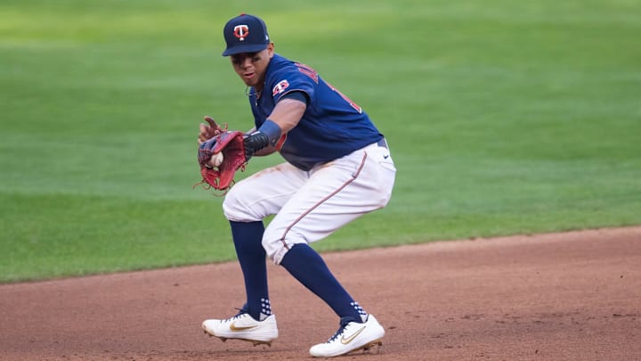 Sep 4, 2020; Minneapolis, Minnesota, USA; Minnesota Twins third baseman Ehire Adrianza (13) fields a ground ball in the seventh inning against the Detroit Tigers at Target Field.