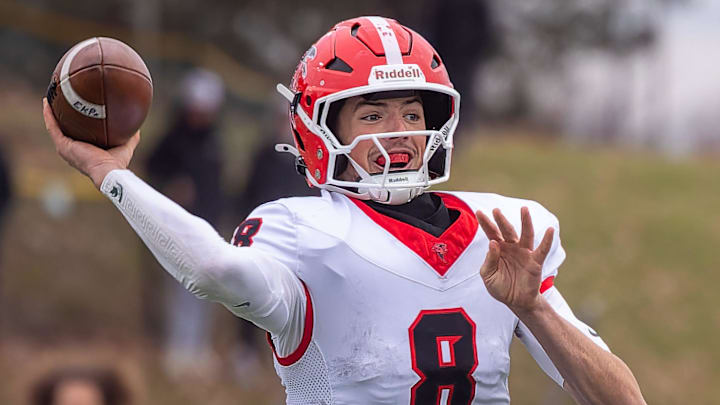 East Kentwood's Kayd Coffman fires a pass to the flat during a victory over Howell Saturday, Nov. 8, 2025.