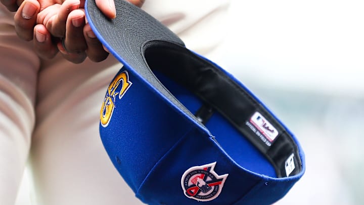 A Seattle Mariners hat is pictured during the National Anthem before a game against the Atlanta Braves on Sept. 11, 2022, at T-Mobile Park.