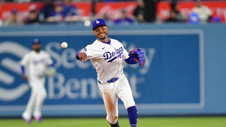 Mar 31, 2026; Los Angeles, California, USA; Los Angeles Dodgers shortstop Mookie Betts (50) throws to first for the out against Cleveland Guardians shortstop Gabriel Arias (13) during the fifth inning at Dodger Stadium. Mandatory Credit: Gary A. Vasquez-Imagn Images