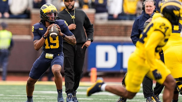 Michigan head coach Sherrone Moore watches quarterback Bryce Underwood (19) during the first half of the spring game at Michigan Stadium in Ann Arbor on Saturday, April 19, 2025.