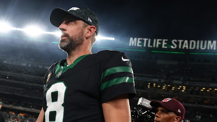 Oct 31, 2024; East Rutherford, New Jersey, USA; New York Jets quarterback Aaron Rodgers (8) walks off the field after the Jets win over the Houston Texans at MetLife Stadium. Mandatory Credit: Ed Mulholland-Imagn Images
