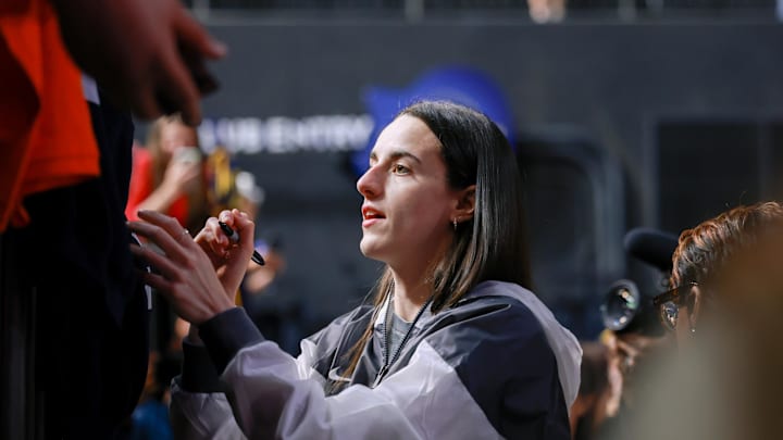 May 28, 2025; Washington, District of Columbia, USA; Indiana Fever guard Caitlin Clark (22) signs autographs for fans before the game against the Washington Mystics at Entertainment & Sports Arena. Mandatory Credit: Emily Faith Morgan-Imagn Images May 28, 2025; Washington, District of Columbia, USA; Indiana Fever guard Caitlin Clark (22) signs autographs for fans before the game against the Washington Mystics at Entertainment & Sports Arena. Mandatory Credit: Emily Faith Morgan-Imagn Images