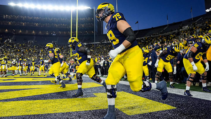 Michigan offensive lineman Jeffrey Persi (79) warms up with his group before the Michigan State game at Michigan Stadium in Ann Arbor on Saturday, Oct. 26, 2024. Michigan offensive lineman Jeffrey Persi (79) warms up with his group before the Michigan State game at Michigan Stadium in Ann Arbor on Saturday, Oct. 26, 2024.