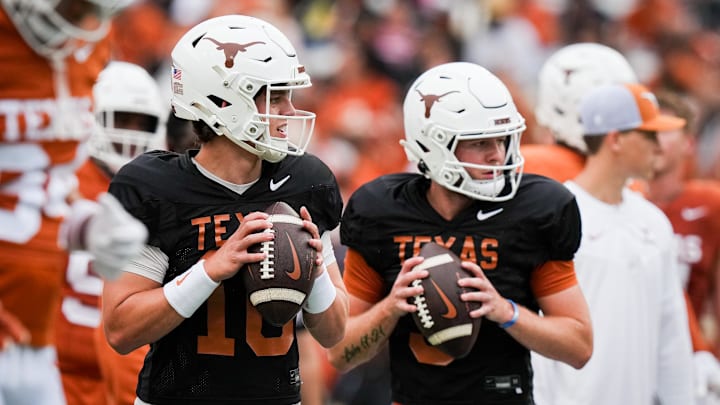 April 20, 2024; Austin, Texas, USA: Texas Longhorns quarterbacks Arch Manning (16), left, and  Quinn Ewers (3) throw passes while warming up ahead of the Longhorns' spring Orange and White game at Darrell K Royal Texas Memorial Stadium. Mandatory Credit: Sara Diggins-Imagn Images via American Statesman