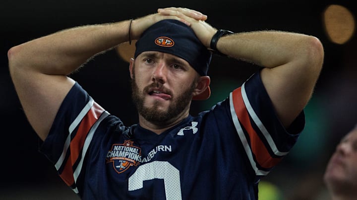 A nervous Auburn fan watches on in the fourth quarter at AT&T Stadium in Arlington, Texas, on Saturday, Aug. 31, 2019. 
