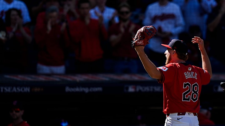 Cleveland Guardians pitcher Tanner Bibee (28) cheers on as he walks back to the dugout for pitching change during the fifth inning of Game 1 of ALDS at Progressive Field in Cleveland, Ohio on Saturday, Oct. 5, 2024.