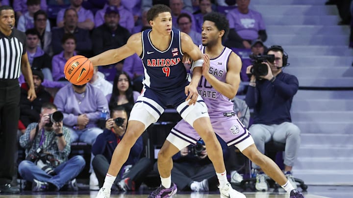 Feb 11, 2025; Manhattan, Kansas, USA; Arizona Wildcats forward Carter Bryant (9) is guarded by Kansas State Wildcats guard David Castillo (10) during the first half at Bramlage Coliseum. Feb 11, 2025; Manhattan, Kansas, USA; Arizona Wildcats forward Carter Bryant (9) is guarded by Kansas State Wildcats guard David Castillo (10) during the first half at Bramlage Coliseum.