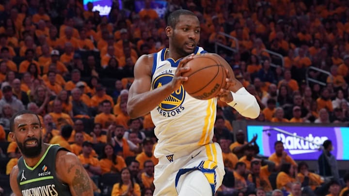 May 10, 2025; San Francisco, California, USA; Golden State Warriors forward Jonathan Kuminga (00) grabs a rebound in front of Minnesota Timberwolves guard Mike Conley (10) in the second quarter during game three in the second round of the 2025 NBA Playoffs at Chase Center. Mandatory Credit: David Gonzales-Imagn Images