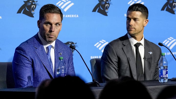 Feb 1, 2024; Charlotte, NC, USA; Carolina Panthers general manager Dan Morgan (left) speaks with new coach Dave Canales during the introductory press conference at Bank of America Stadium. Mandatory Credit: Jim Dedmon-Imagn Images