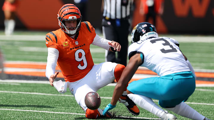 Sep 14, 2025; Cincinnati, Ohio, USA; Cincinnati Bengals quarterback Joe Burrow (9) goes for the loose ball with Jacksonville Jaguars cornerback Tyson Campbell (3) during the first quarter at Paycor Stadium. Mandatory Credit: Joseph Maiorana-Imagn Images Sep 14, 2025; Cincinnati, Ohio, USA; Cincinnati Bengals quarterback Joe Burrow (9) goes for the loose ball with Jacksonville Jaguars cornerback Tyson Campbell (3) during the first quarter at Paycor Stadium. Mandatory Credit: Joseph Maiorana-Imagn Images