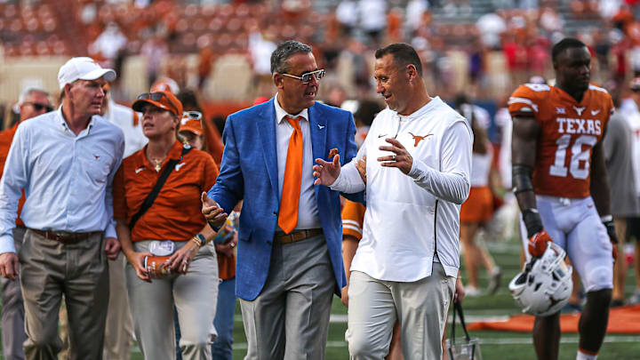 Texas athletic director Chris Del Conte, left, said he plans to discuss a possible contract extension and raise for head football coach Steve Sarkisian, right, in the next few weeks. Sarkisian has three years left on his contract and is the country's 30th highest-paid coach.