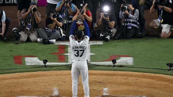 Jul 15, 2024; Arlington, TX, USA; National League outfielder Teoscar Hernandez of the Los Angeles Dodgers (37) poses with the trophy after he wins the 2024 All Star Game Home Run Derby at Globe Life Field. Mandatory Credit: Jerome Miron-USA TODAY Sports