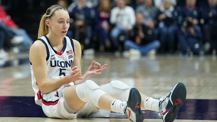 Jan 22, 2025; Storrs, Connecticut, USA; UConn Huskies guard Paige Bueckers (5) reacts after her three point basket and being fouled by the Villanova Wildcats in the first half at Harry A. Gampel Pavilion. Mandatory Credit: David Butler II-Imagn Images
