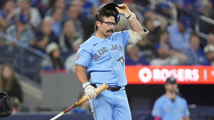 Jun 24, 2026; Toronto, Ontario, CAN; Toronto Blue Jays left fielder Davis Schneider (36) adjusts his helemt after taking a strike against the Houston Astros during the seventh inning at Rogers Centre. Mandatory Credit: John E. Sokolowski-Imagn Images