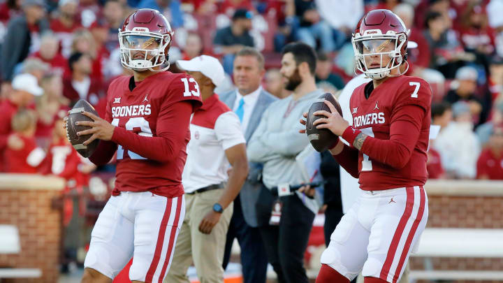 Oklahoma's Caleb Williams (13) and Spencer Rattler (7) warm up before a game back in 2021