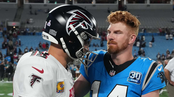 Carolina Panthers quarterback Andy Dalton (14) and Atlanta Falcons quarterback Kirk Cousins