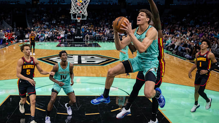 Nov 30, 2024; Charlotte, North Carolina, USA; Charlotte Hornets forward Tidjane Salaun (31) shoots the ball against Atlanta Hawks center Clint Capela (15) during the first quarter at Spectrum Center. Mandatory Credit: Scott Kinser-Imagn Images Nov 30, 2024; Charlotte, North Carolina, USA; Charlotte Hornets forward Tidjane Salaun (31) shoots the ball against Atlanta Hawks center Clint Capela (15) during the first quarter at Spectrum Center. Mandatory Credit: Scott Kinser-Imagn Images