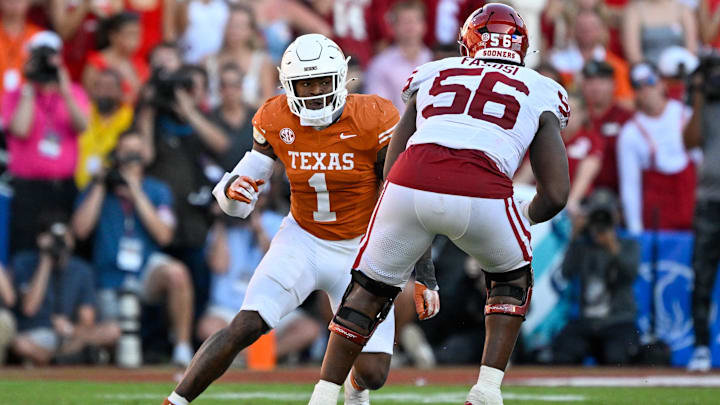 Oct 11, 2025; Dallas, Texas, USA; Oklahoma Sooners offensive lineman Michael Fasusi (56) blocks Texas Longhorns defensive end Colin Simmons (1) during the game between the Texas Longhorns and the Oklahoma Sooners at the Cotton Bowl. Mandatory Credit: Jerome Miron-Imagn Images