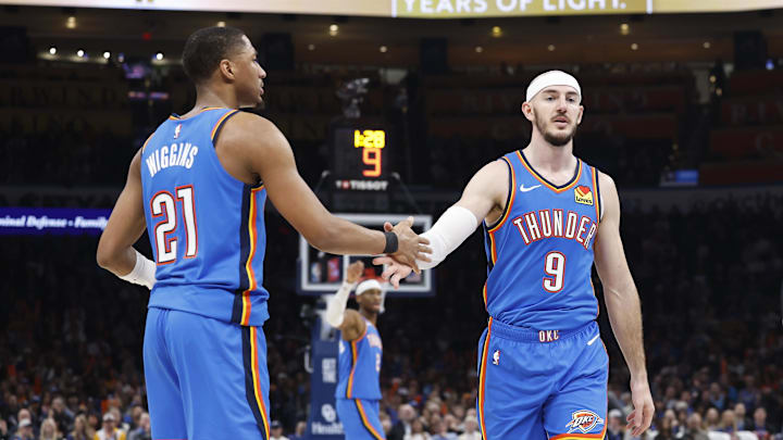 Feb 7, 2025; Oklahoma City, Oklahoma, USA; Oklahoma City Thunder guard Alex Caruso (9) high fives guard Aaron Wiggins (21) after a play against the Toronto Raptors during the second quarter at Paycom Center. Mandatory Credit: Alonzo Adams-Imagn Images Feb 7, 2025; Oklahoma City, Oklahoma, USA; Oklahoma City Thunder guard Alex Caruso (9) high fives guard Aaron Wiggins (21) after a play against the Toronto Raptors during the second quarter at Paycom Center. Mandatory Credit: Alonzo Adams-Imagn Images