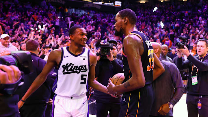 Jan 16, 2024; Phoenix, Arizona, USA; Phoenix Suns forward Kevin Durant (35) greets Sacramento Kings guard De'Aaron Fox (5) following the Suns 119-117 victory at Footprint Center. Mandatory Credit: Mark J. Rebilas-Imagn Images
