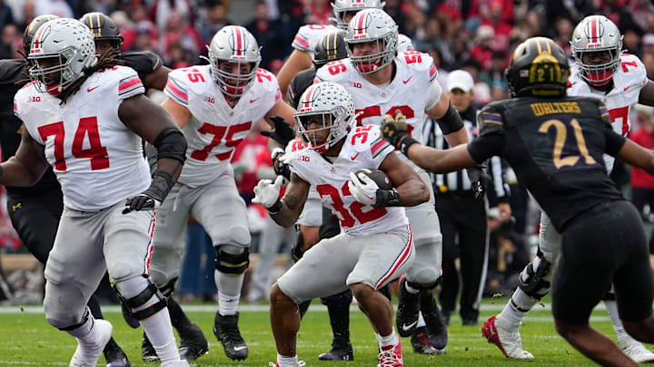 Ohio State Buckeyes running back TreVeyon Henderson (32) runs upfield during the second half 