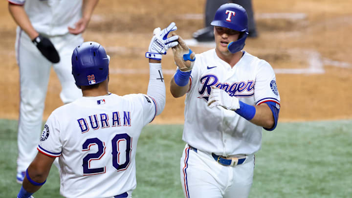 Texas Rangers third baseman Josh Jung (6) celebrates with Texas Rangers second baseman Ezequiel Duran.